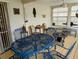 Enclosed patio with metal patio furniture, wood decor, and lots of light at 1628 Paradise Ln, Astor, FL 32102
