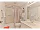 Cozy bathroom features a shower-tub combination and ample counter space at 3 Oceans West Blvd # 5C4, Daytona Beach Shores, FL 32118