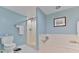 Well-lit bathroom complete with separate shower and tub at 3 Oceans West Blvd # 5C4, Daytona Beach Shores, FL 32118