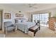 Bright bedroom with balcony access, ceiling fan, and water views at 3 Oceans West Blvd # 5C4, Daytona Beach Shores, FL 32118