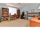 Bright bedroom with a light blue color scheme, ceiling fan, and built-in bookshelves at 3 Oceans West Blvd # 5C4, Daytona Beach Shores, FL 32118