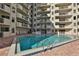 Community pool with plenty of sunshine for relaxing at 3 Oceans West Blvd # 5C4, Daytona Beach Shores, FL 32118