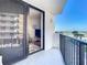 Balcony with sliding glass doors leading to a cozy living area; enjoy a relaxing ocean view at 1415 Ocean Shore Blvd # 309, Ormond Beach, FL 32176