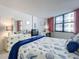 Bedroom featuring a large window with seating and work desk at 1415 Ocean Shore Blvd # 309, Ormond Beach, FL 32176