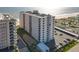 Exterior view featuring condo building, balconies, parking, and scenic ocean at 1415 Ocean Shore Blvd # 309, Ormond Beach, FL 32176