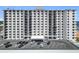 Condominium exterior with balconies, ample parking, and ocean views at 1415 Ocean Shore Blvd # 309, Ormond Beach, FL 32176