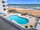 Inviting outdoor pool with beachfront access, ideal for enjoying the ocean breeze at 1415 Ocean Shore Blvd # 309, Ormond Beach, FL 32176
