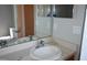 Bathroom with double vanity, a large mirror, and neutral colors at 1562 Pendleton St, Deltona, FL 32725