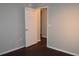 Bedroom with dark laminate flooring and door to another room at 1562 Pendleton St, Deltona, FL 32725