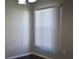 Dining area with dark floors and a window with blinds at 1562 Pendleton St, Deltona, FL 32725