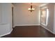 Dining room with dark hardwood floors and a chandelier at 1562 Pendleton St, Deltona, FL 32725