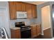 Kitchen with stainless steel appliances and wood cabinets at 1562 Pendleton St, Deltona, FL 32725