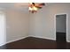 Living room with dark hardwood floors, neutral walls, and a ceiling fan at 1562 Pendleton St, Deltona, FL 32725