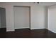 Living room with dark floors and built-in shelving at 1562 Pendleton St, Deltona, FL 32725