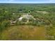 Aerial view showing home, pool, and expansive property at 32200 Ponderosa Ave, Deland, FL 32720