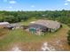 Aerial view of the property, showing house, pool, and outbuildings at 32200 Ponderosa Ave, Deland, FL 32720