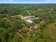 Aerial view of home on large lot with pool and outbuildings at 32200 Ponderosa Ave, Deland, FL 32720