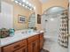 Clean bathroom with single vanity and bathtub shower combo at 32200 Ponderosa Ave, Deland, FL 32720