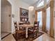 Bright dining room with a rustic wooden table and chandelier at 32200 Ponderosa Ave, Deland, FL 32720