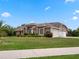 House exterior showcasing a side view with a two-car garage at 32200 Ponderosa Ave, Deland, FL 32720