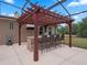 Enjoy this outdoor kitchen and pergola at 32200 Ponderosa Ave, Deland, FL 32720