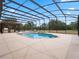 Inviting pool and spa with a covered patio at 32200 Ponderosa Ave, Deland, FL 32720