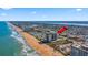 Aerial view with arrow points to beach condo building with beachfront access and ocean views at 1513 Ocean Shore Blvd # 7B, Ormond Beach, FL 32176