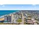 Aerial view of property offering ocean views, road access, and proximity to a charming coastal town at 1513 Ocean Shore Blvd # 7B, Ormond Beach, FL 32176