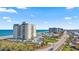 Excellent aerial view of the condominium complex and road running along the Atlantic Ocean, with the beach at 1513 Ocean Shore Blvd # 7B, Ormond Beach, FL 32176