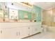 Bathroom featuring a dual sink vanity with plenty of counter space and a shower-tub combo at 1513 Ocean Shore Blvd # 7B, Ormond Beach, FL 32176
