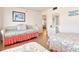 Nicely decorated guest bedroom, featuring multiple beds and ample space at 1513 Ocean Shore Blvd # 7B, Ormond Beach, FL 32176