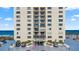 The Ormondy condo building, featuring balconies, landscaping, and convenient parking at 1513 Ocean Shore Blvd # 7B, Ormond Beach, FL 32176