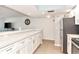 Stylish kitchen featuring bright lighting, sleek countertops, and stainless steel appliances at 1513 Ocean Shore Blvd # 7B, Ormond Beach, FL 32176