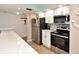 Well-equipped kitchen with stainless steel appliances and plenty of counter space at 1513 Ocean Shore Blvd # 7B, Ormond Beach, FL 32176