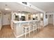 Bright kitchen with a breakfast bar, stainless steel appliances, and white cabinetry at 1513 Ocean Shore Blvd # 7B, Ormond Beach, FL 32176
