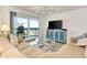 Inviting living room with a large sliding door, balcony, and views of the ocean at 1513 Ocean Shore Blvd # 7B, Ormond Beach, FL 32176