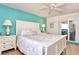 Beautifully decorated main bedroom featuring a king bed, balcony access, and soothing color palette at 1513 Ocean Shore Blvd # 7B, Ormond Beach, FL 32176
