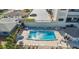 Sparkling community pool provides ample seating, shade, and a serene setting for residents' relaxation at 1513 Ocean Shore Blvd # 7B, Ormond Beach, FL 32176