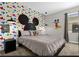 Playful bedroom with colorful Mickey Mouse wallpaper and a king-size bed at 505 Ocean Course Ave # 505, Davenport, FL 33896