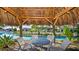 The covered poolside cabana area includes comfortable seating, ideal for relaxation and entertaining at 505 Ocean Course Ave # 505, Davenport, FL 33896