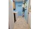 Laundry room with washer, dryer, and storage shelves at 24008 Ermine Rd, Astor, FL 32102