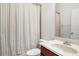 Standard bathroom with shower/tub combo with striped shower curtain and a single sink vanity at 111 Asterbrooke Dr, Deland, FL 32724