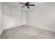 Bedroom featuring neutral carpet, white trim and walls, and a ceiling fan at 111 Asterbrooke Dr, Deland, FL 32724