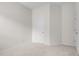 Spacious bedroom featuring neutral carpet, white trim and walls, and a closet at 111 Asterbrooke Dr, Deland, FL 32724