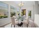 Bright dining area with view of backyard pool and spa at 111 Asterbrooke Dr, Deland, FL 32724