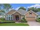 One story house with stone accents and a two car garage at 111 Asterbrooke Dr, Deland, FL 32724