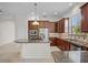 Spacious kitchen with granite countertops and stainless steel appliances at 111 Asterbrooke Dr, Deland, FL 32724