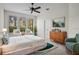 Sunlit main bedroom with sitting area and relaxing decor at 111 Asterbrooke Dr, Deland, FL 32724