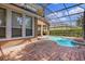 A screened-in pool and patio area provides an outdoor living space at 111 Asterbrooke Dr, Deland, FL 32724