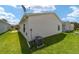 Exterior view of a well-maintained home with a lush green lawn at 1106 Carvello Dr, The Villages, FL 32162